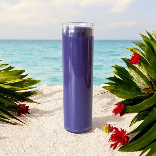 Tall purple 7-day candle on white sand with green leaves & tropical flowers. Serene ocean background for spiritual awakening.
